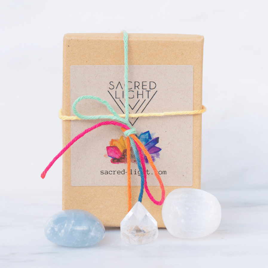 Sacred Light Soundbaths and Crystals high vibration gem stone set featuring colorful polished stones and natural crystal formations.