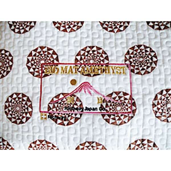 Cotton pad used with Mini Biomat® 7000MX for skin contact and cleansing, featuring soft, absorbent material.