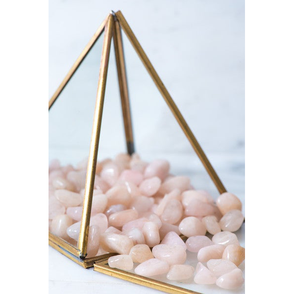 Small tumbled Morganite stone from Sacred Light Soundbaths and Crystals, showcasing soft peach-pink hues and smooth polished surface.