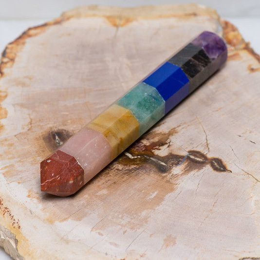 Polished chakra wand from Sacred Light Soundbaths and Crystals, smooth crystal healing wand with vibrant coloration and polished finish.